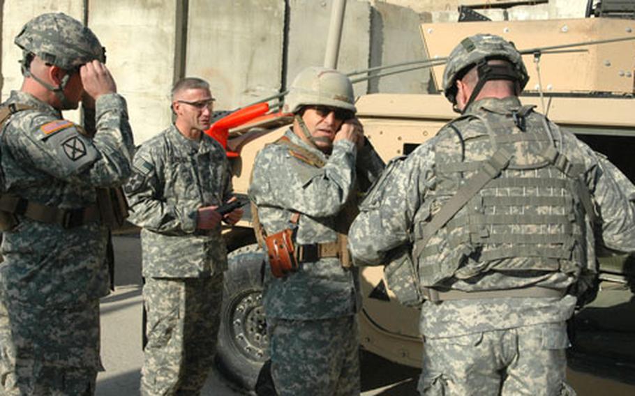Army Gen. George Casey, commander of Multi-national Force – Iraq, puts his combat gear on at Forward Operating Base Loyalty as he prepares to visit a new joint security station in East Baghdad.