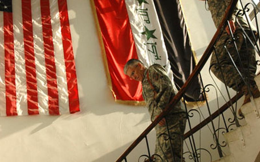 Army Gen. George Casey, commander of Multi-national Force – Iraq, climbs down the stairs of the tactical operations center at Forward Operating Base Loyalty during a site visit on Wednesday to the 2nd Infantry Division’s 2nd Brigade Combat Team. Behind Casey is the 2nd BCT Command Sergeant Maj. William Johnson.