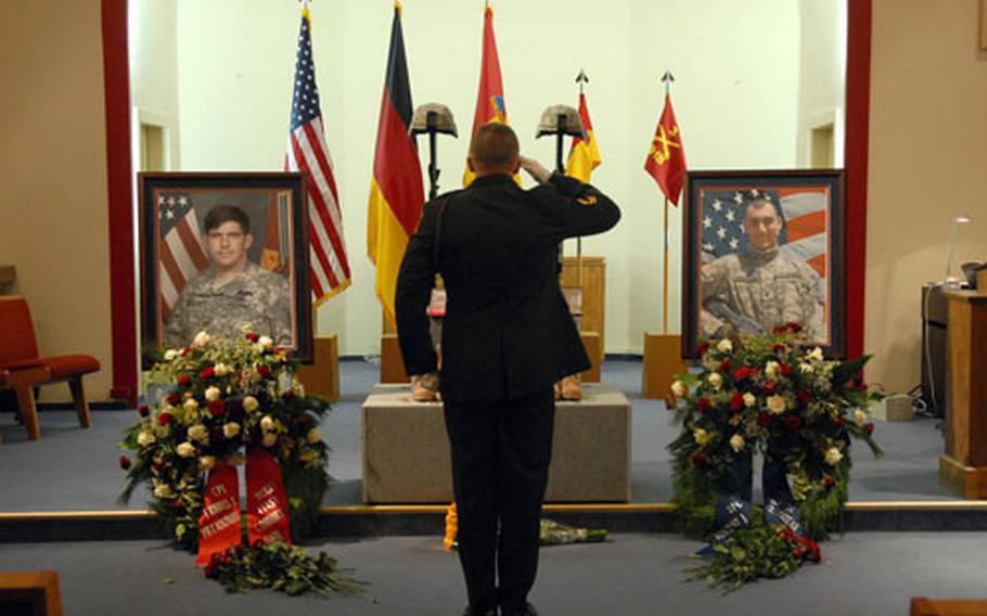 Sgt. 1st Class Scott Ramen, 1st Battalion, 37th Armor Regiment, gives a final salute to Capt. Travis L. Patriquin and Spc. Vincent J. Pomante III following the memorial ceremony for the soldiers at Ray Barracks in Friedberg, Germany, on Tuesday evening. The 1st Brigade Combat Team soldiers were killed in Iraq on Dec. 6, 2006.