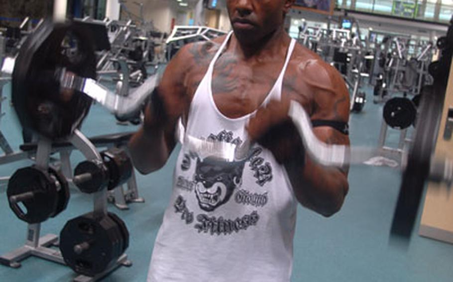Staff Sgt. Michael Brooks of Clarksville, Tenn., works out at the Grafenwöhr fitness center Thursday in Germany. The top commander in the area said Wednesday that Army garrisons in Europe are considering using U.S. troops to keep MWR fitness centers longer.