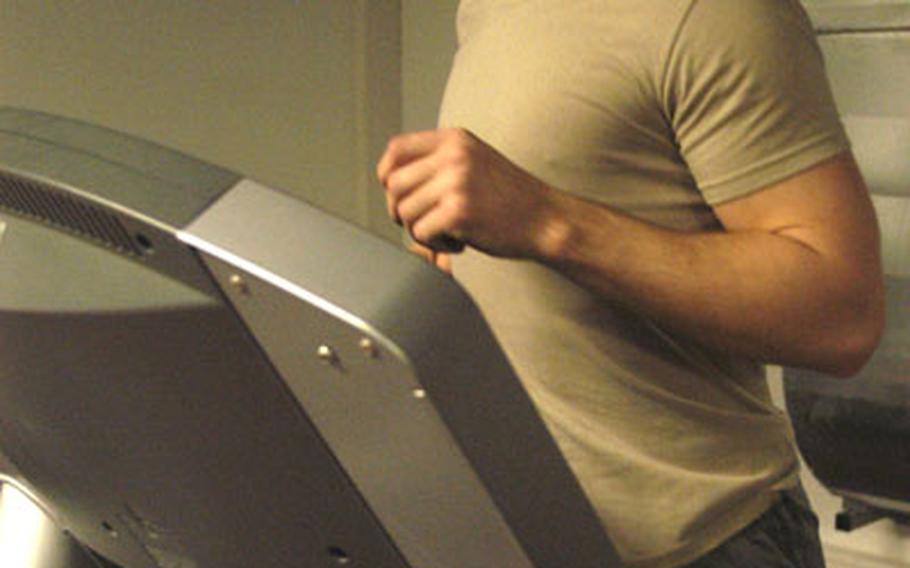 Spc. Adam Kane, a member of the Connecticut National Guard&#39;s 643rd Military Police Company, runs on a treadmill in Darmstadt, Germany, Friday.