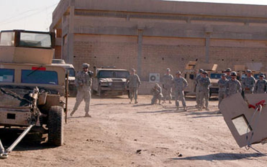A Humvee door is pulled off using the Rat Claw, a flat steel hook developed by 2nd Brigade Combat Team, 10th Mountain Division (LI) Safety Officer Bill Del Solar. Del Solar developed the Rat Claw to aid in extrication of Soldiers from Humveees when the doors are damaged or wedged shut.