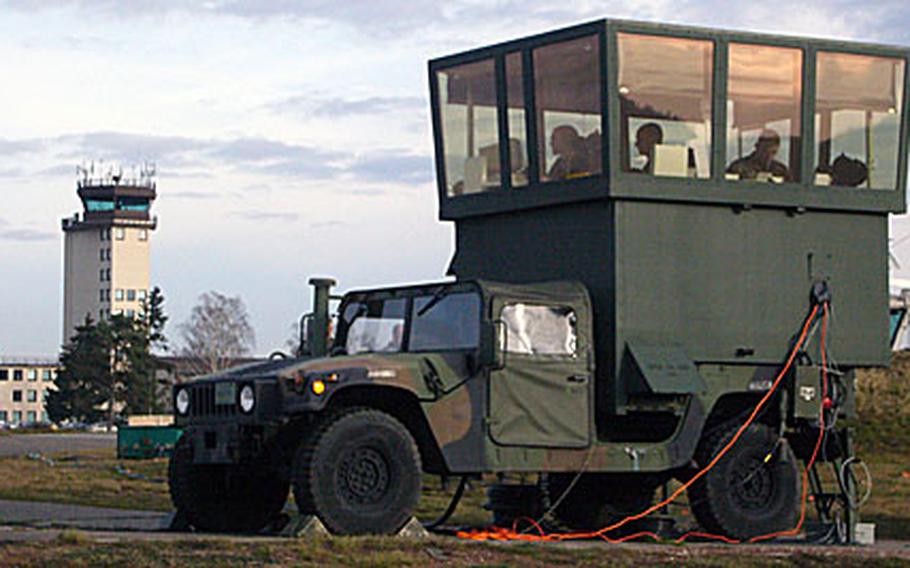 Air traffic controllers will be working out of this mobile control tower at Ramstein Air Base, Germany, for the next two months as their 10-story tower (seen in the background), gets a $313,000 refurbishment.