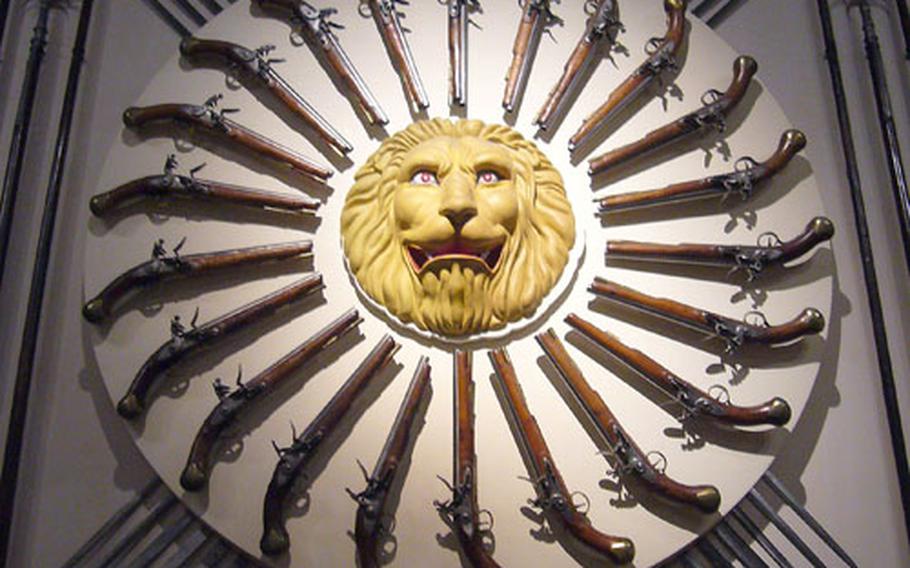 A collection of 18th century flintlock sea service pistols make an elaborate display in an armory exhibit inside the White Tower.
