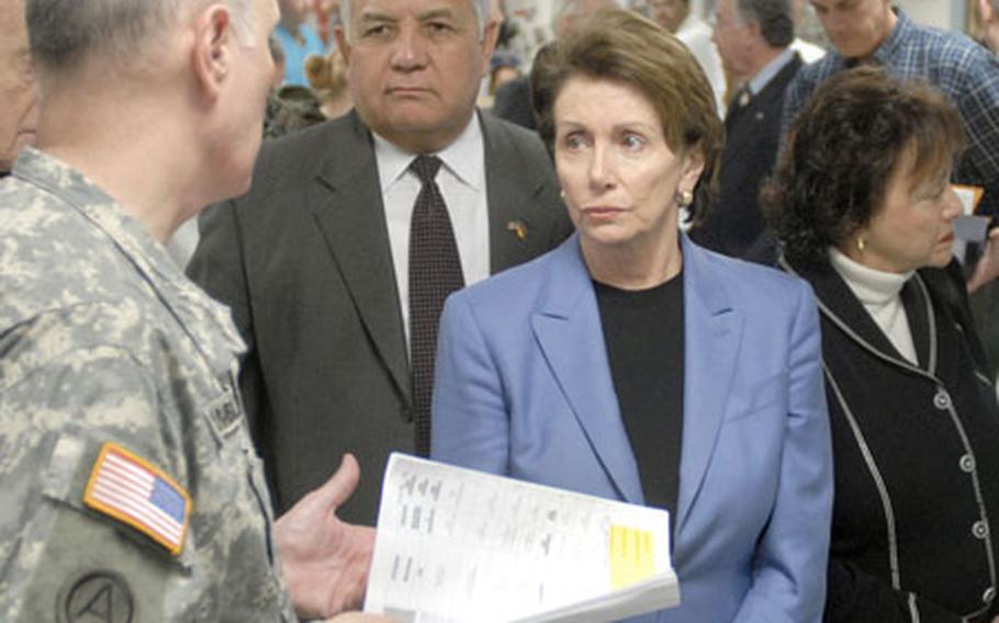 Pelosi, flanked by Reps. Silvestre Reyes, D-Texas, and Nita M. Lowey, D-N.Y., listens as Col. Bryan Gamble, commander of Landstuhl Regional Medical Center in Germany, talks about the center&#39;s intensive-care unit Monday. Seven members of Congress made the stop to visit wounded troops after a trip to the Middle East.