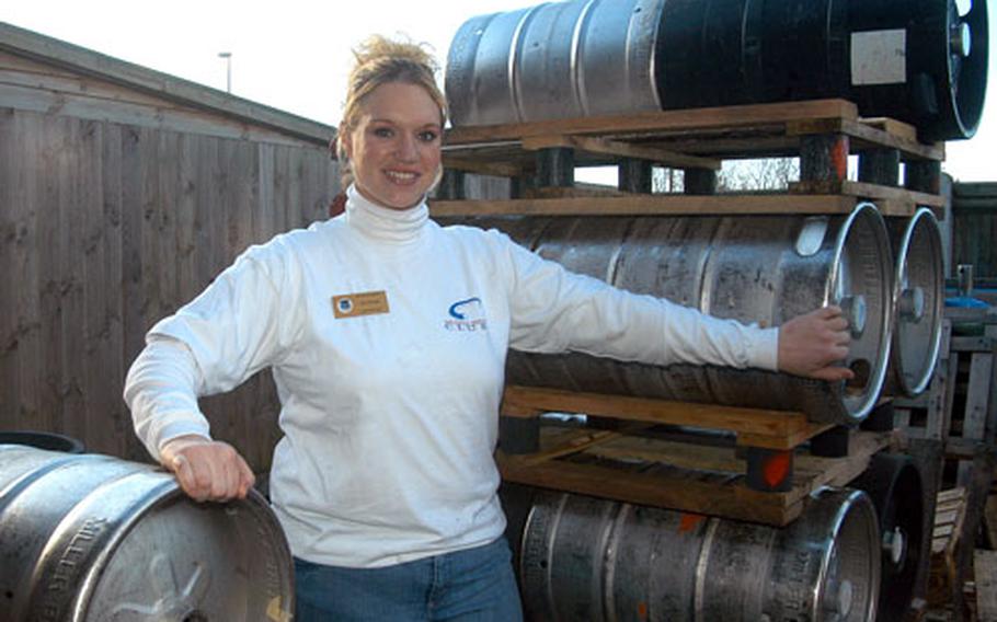 Bartender Jennifer Abrego stands next to Liberty Club&#39;s stock of kegs, which will come in handy when the club holds their Super Bowl party.