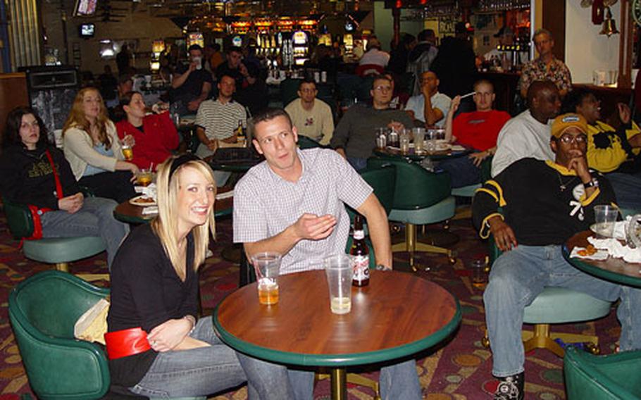 Football fans enjoy last year&#39;s Super Bowl inside the Liberty Club on RAF Lakenheah.