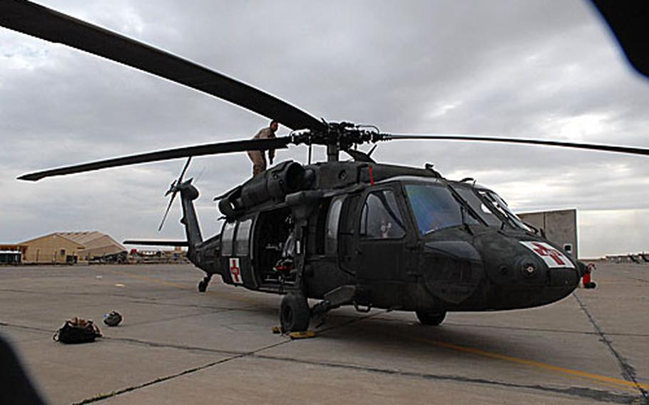 Sgt. Scott McDonald performs a pre-flight check in Tikrit, Iraq on Thursday. Company C, 3rd Battalion, 25th Aviation Regiment, 25th Combat Aviation Brigade, 25th Infantry Division has been based in Tikrit for about six months.