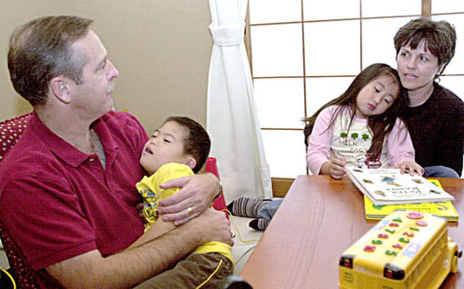 When Juda Smith, 6, and adopted sister Bethany, 5, tire, they want to snuggle in Dad or Mom's arms for comfort. Tom and Shirley Smith said they were starting to feel the empty-nest syndrome as their three birth sons grew older and so restocked their nest by adopting the two Japanese children as infants.