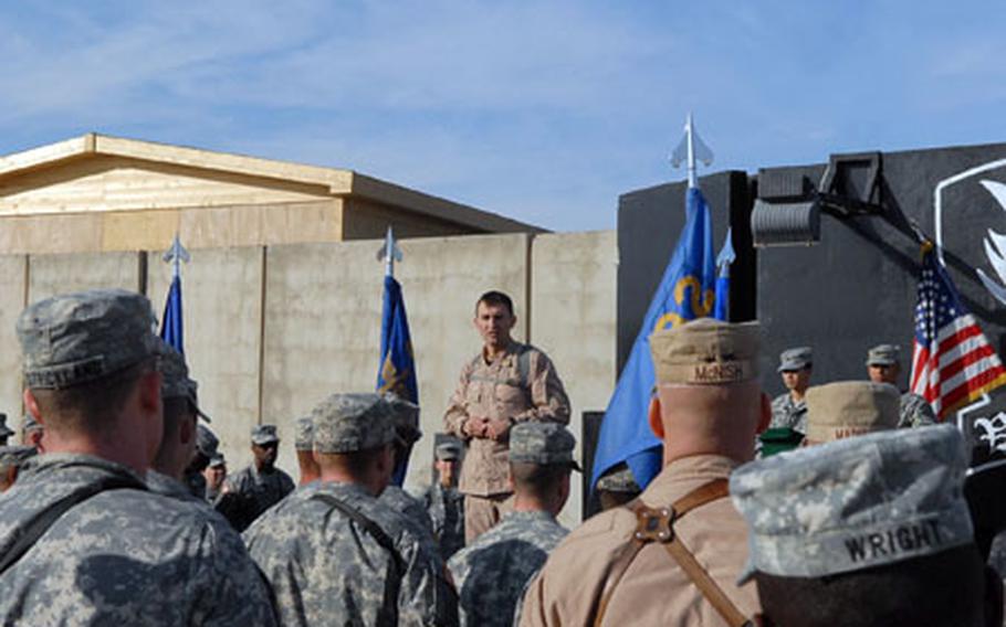 Col. A.T. Ball, commander of the 25th Infantry Division's Combat Aviation Brigade based in Camp Speicher in northern Iraq, speaks to soldiers about the latest downed helicopter.