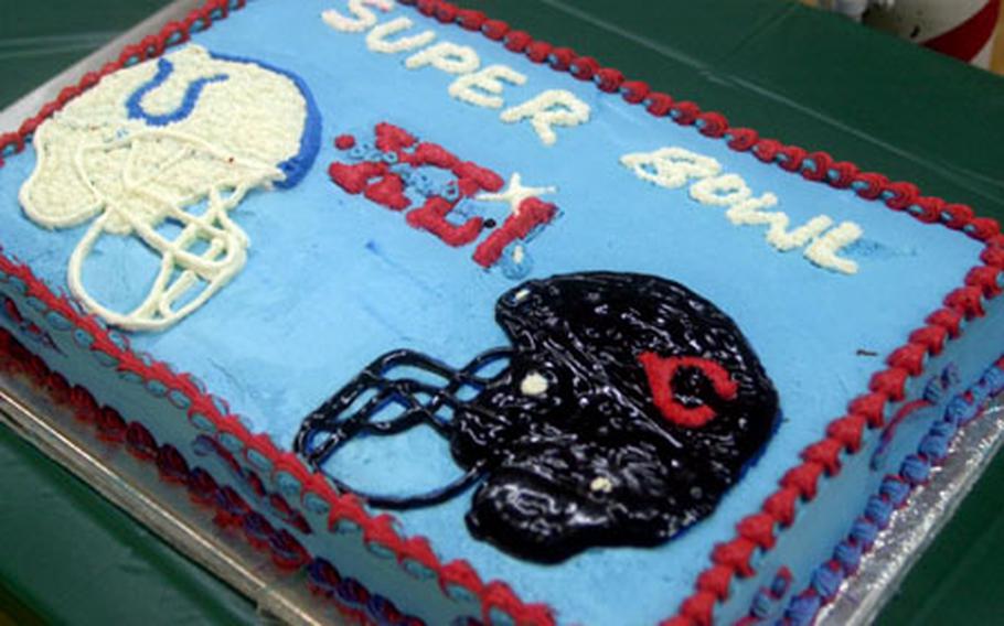 A cake is displayed at an early morning Super Bowl viewing party at the Camp Ripper chow hall at Al Asad Air Base in Iraq. Dozens of troops enjoyed cake, ate chicken wings and watched the game, which aired at 2:30 a.m. Monday.