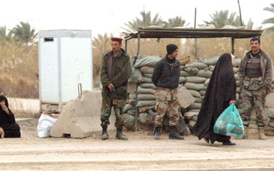 A checkpoint along the main road from Baghdad to Salman Pak is manned by Iraqi national police, whom the local Sunnis accuse of colluding with Shiite militias to rob, kidnap and even kill them.