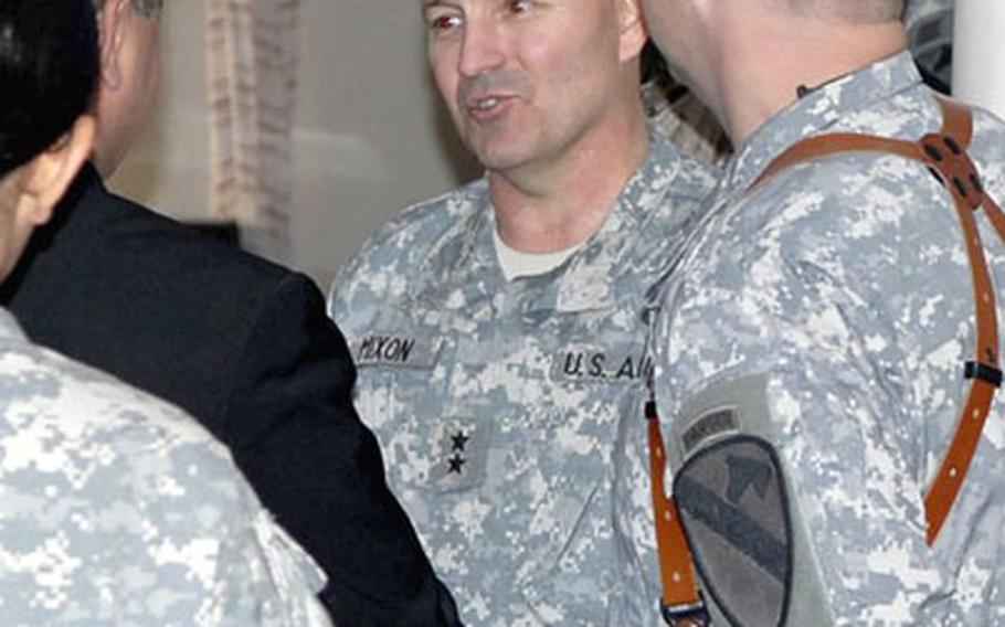 Maj. Gen. Benjamin Mixon, with a cadre of U.S. troops around him, meets members of Diyala’s provincial council on Monday in Baqouba, Iraq.