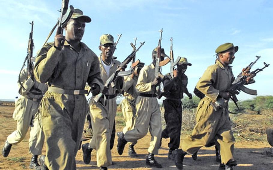 Ethiopian soldiers chant and pump their Kalashnikov rifles following a day of training in the field with U.S. military instructors in December. Defense Secretary Robert Gates said Tuesday the Pentagon will set up a new command, to be known as Africa Command, to oversee its operations there.