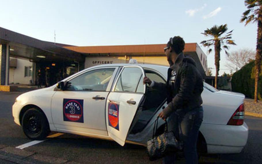 Tyvette Brittingham takes the new taxi cab service on base at Yokota Air Base, Japan on Feb. 1, 2007.