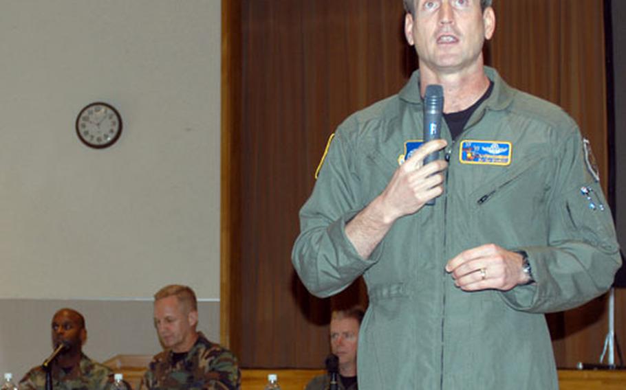 Col. Terrence J. O'Shaughnessy, 35th Fighter Wing commander, addresses spouses of deployed airmen at a town hall meeting Tuesday morning at Misawa Air Base, Japan.