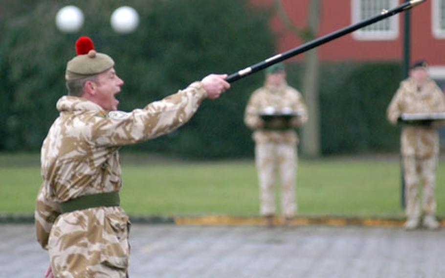 Scottish Warrant Officer 1st Class Lorne Campbell, sergeant major of NATO’s Allied Rapid Reaction Corps, shouts orders to soldiers assembled for a medal ceremony at a homecoming event for the unit. The unit, which led the International Security Assistance Force in Afghanistan, recently returned to Rheindahlen, Germany, after its nine-month tour.