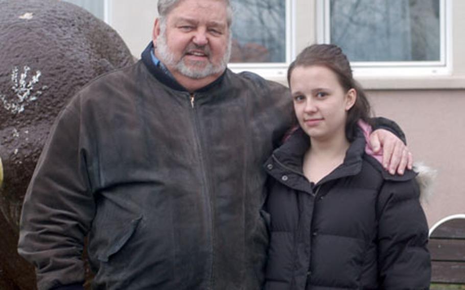 Larry Fillmore and his daughter, Megan, stand in front of Mannheim High School, where Megan was disciplined with an in-school suspension for fighting after being punched by another student. Her father says she should be able to defend herself without repercussions.