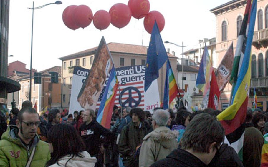 Wearing a variety of colors and carrying flags and banners with dramatic messages, a protest in Vicenza, Italy, on Saturday had the atmosphere of a large, meandering party. A large police presence helped keep problems at a minimum, at least before the sun set.