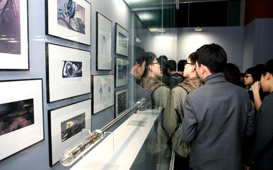 Visitors crowd the Stars Wars exhibit at the COEX exhibition mall in Seoul.