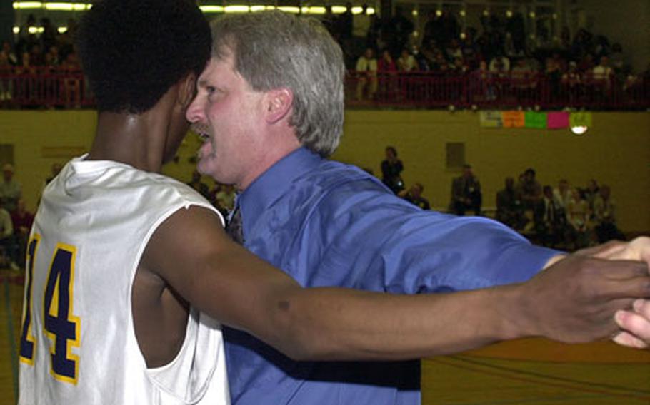 Heidelberg Lion head coach Brad Shahan congratulates one of his players during the final moments of the 2003 Division 1 basketball championship game in Mannheim, Germany. For Shahan it was the fourth title in as many years. Shahan was removed as coach this month for disciplinary reasons.