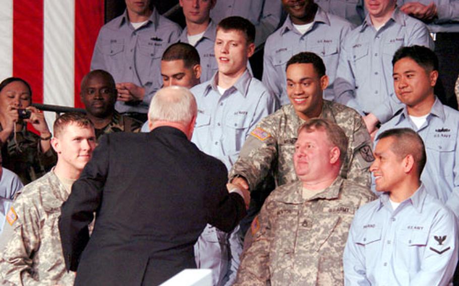 Vice President Dick Cheney shakes hands with servicemembers on the USS Kitty Hawk Wednesday in Yokosuka, Japan.