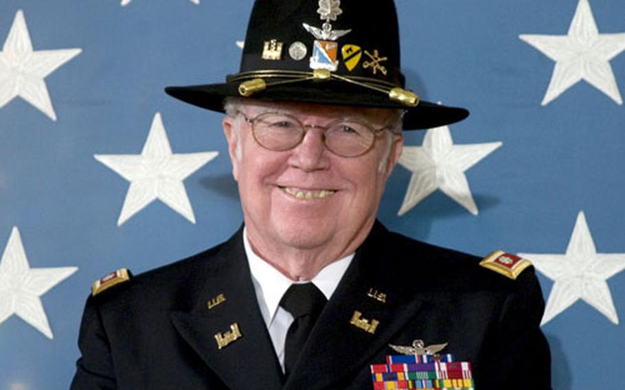 Retired Army Lt. Col. Bruce Crandall laughs as President Bush jokes about the latest Medal of Honor recipient's childhood during Monday's ceremony at the White House.