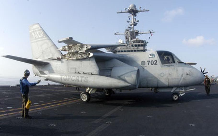 An S-3B Viking from Sea Control Squadron 31 folds its wings and parks Saturday on the flight deck of the aircraft carrier USS John C. Stennis after returning from a mission.