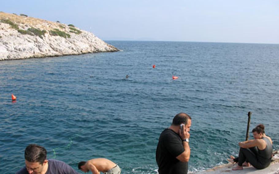 Divers volunteer at the Bay of Vouliagmeni in Greece, the spot where three Americans are believed to have drowned while cave diving 28 years ago. Two of the Americans were based at Hellenikon Air Force Base in Greece at the time.