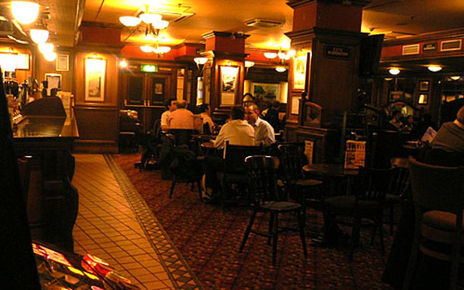 Patrons in the Sir John Oldcastle sit down for a drink and some food on a recent weeknight.