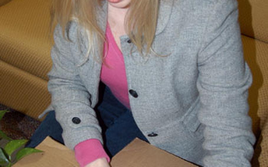 Noel Pearson puts together a care package for her husband, Capt. Patrick Pearson, an F-16 pilot with the 14th Fighter Squadron who is deployed to Balad Air Base, Iraq, for four months.
