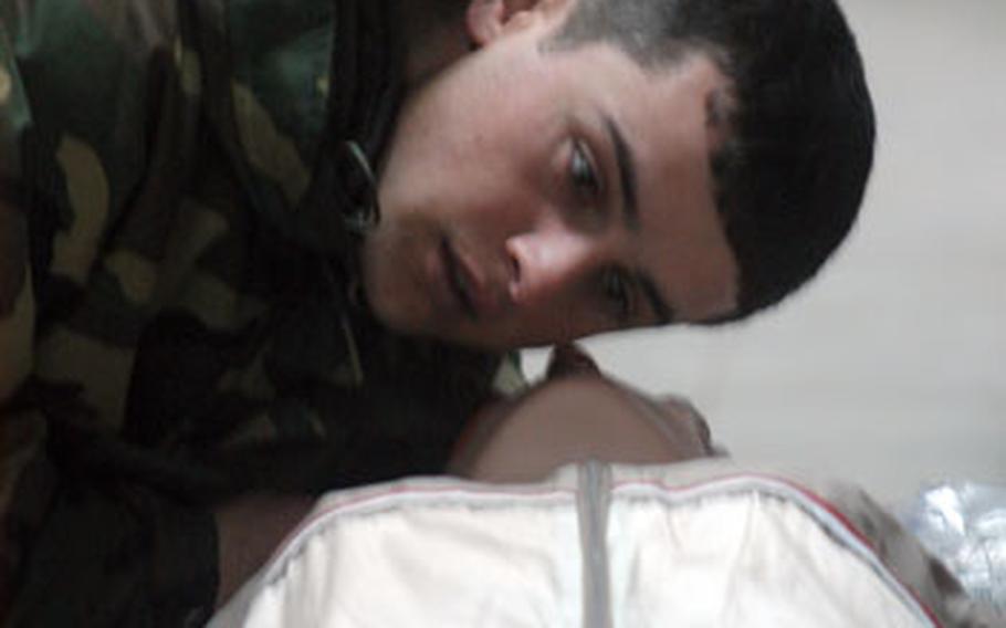 Georgia army Cpl. Raudi Davitadze, 22, performs CPR training on a mannequin Monday. Davitadze and other future platoon medics are in the middle of a three-week course being taught by U.S. European Command forces.