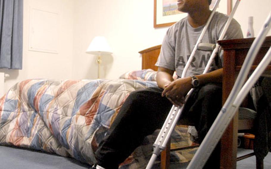 Sgt. Jerry Lee, 27, a soldier from Texarkana, Ark., waits for his next appointment Monday in his outpatient billeting room adjacent to Landstuhl Regional Medical Center in Germany. Last week, LRMC shifted 16 outpatient beds from older Air Force billeting to a newly renovated facility also operated by the Air Force.