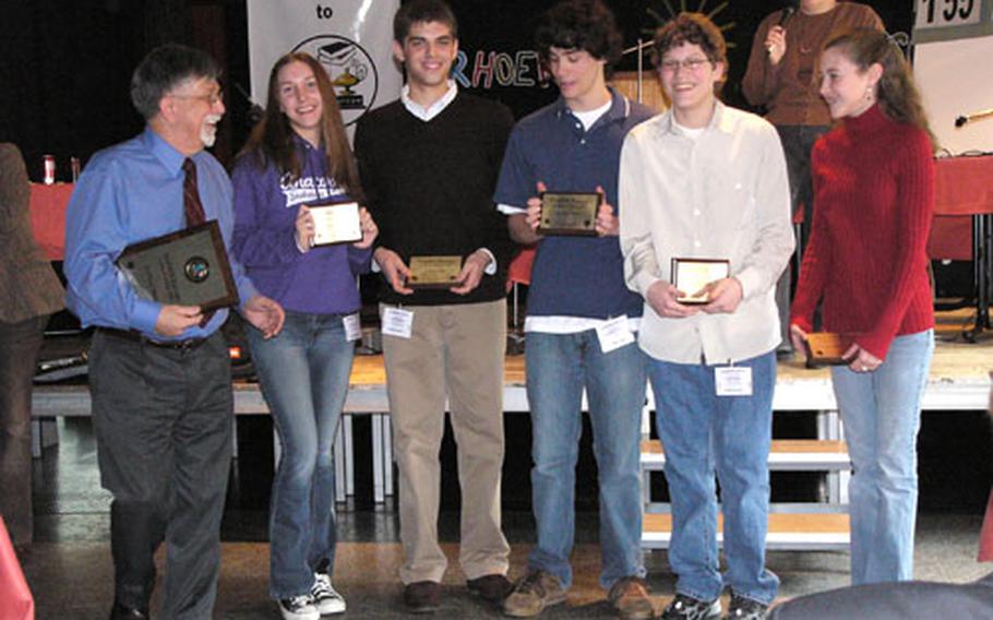 Ankara coach Ray Esack,left, shares the joy of winning the 2007 DODDS-Europe Academic Games in Hambachtal, Germany, on Friday with his team, from Esack's left, Sally Neumann, Kaan Kadlioglu, Christopher Wilson, co-MVP James Snow and Casey Miller. In background is tournament director Bamma McCoy.