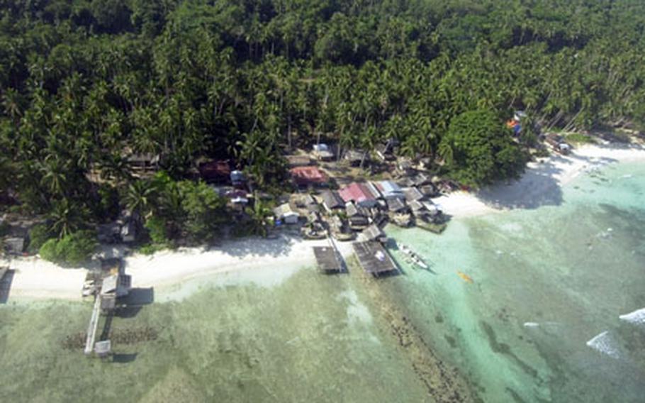 A fishing village is shown from above Jolo Island, Philippines. U.S. and Philippine officials say fighting an insurgency in the island's heavy jungles - and in other areas in the southern Philippines - is a long, tough task. Many insurgents have friends and family -- and often support -- in villages near where they operate.