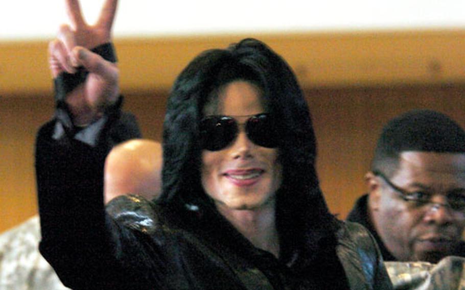 Michael Jackson greets the crowd at Camp Zama, Japan on Saturday.