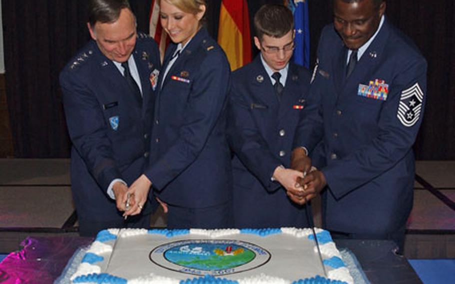 Gen. Tom Hobbins, commander U.S. Air Forces in Europe; 2nd Lt. Amanda DeLancey, a contracting officer with the 52nd Contracting Squadron at Spangdahlem Air Base; Airman Basic James Summerer, a command post controller with the 603rd Air Operations Center/Air Mobility Division at Ramstein Air Base; and Chief Master Sgt. Gary Coleman, USAFE command chief, ceremoniously cut the cake at the USAFE 65th anniversary celebration on Saturday at Ramstein Air Base in Germany. DeLancey and Summerer were chosen to participate in the cake cutting because they were the youngest officer and youngest enlisted airman at the dinner.
