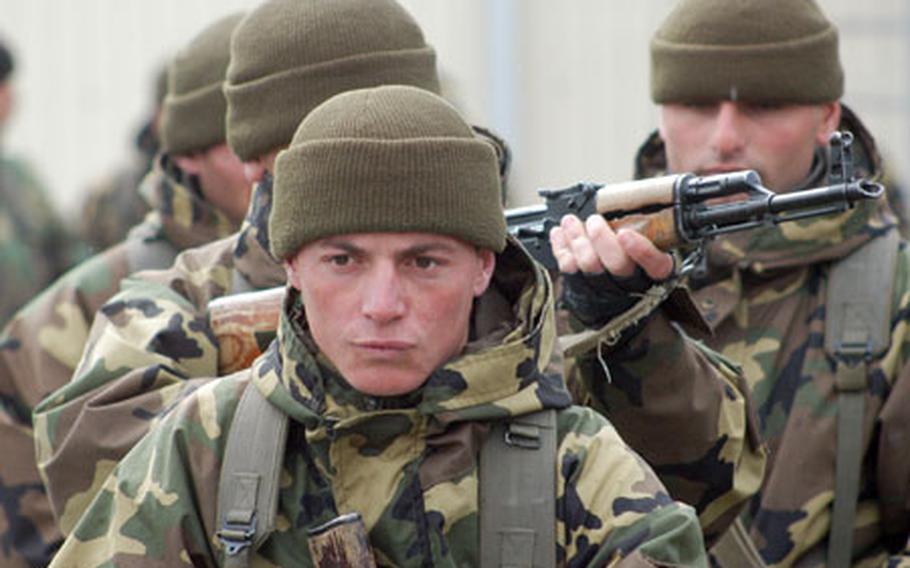 Georgian soldiers prepare to practice room-clearing drills. About 65 U.S. military personnel, mostly soldiers from the Germany-based Joint Multinational Readiness Center, have been in the country of Georgia trying to build an army brigade to NATO and Western standards.