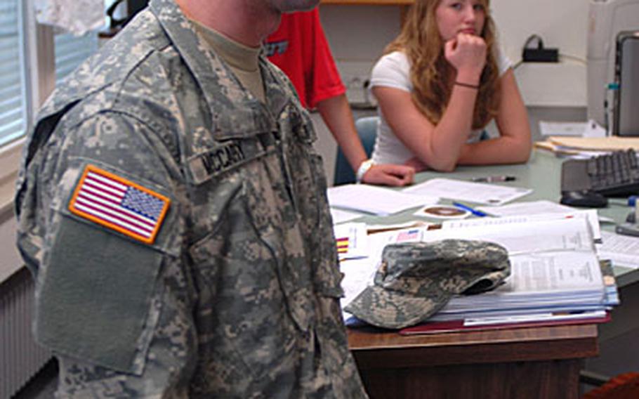 West Point cadet William McCary speaks Wednesday to Vilseck High School students including Becky Linka, 17.