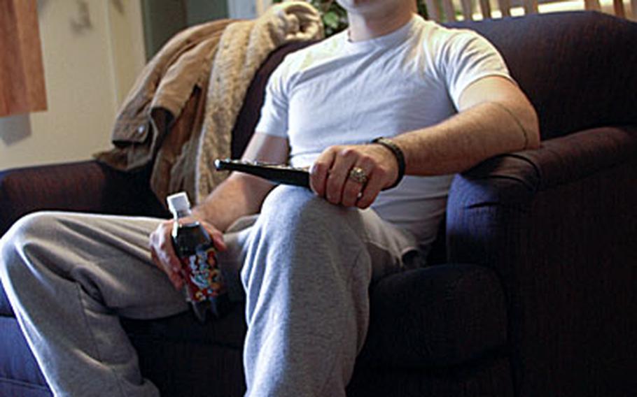 After work, USS Mustin’s Petty Officer 3rd Class Steven Gill, sits down to relax and watch a little television. Now that he has moved off the ship and into the newly renovated Homeport Ashore initiative apartment-style quarters he spends half the time out looking for something to do now that he used to when he lived in Mustin’s shipboard berthing compartment.