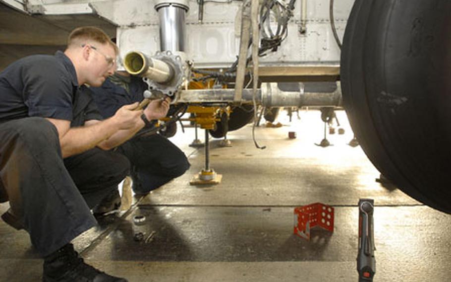 Staff Sgt. Donald Morris, a crew chief assigned to the 86th Aircraft Maintenance Squadron Aero Repair shop, disassembles a C-130’s rear landing gear in preparation for structural repair Thursday at Ramstein Air Base. The aging fleet is suffering from various types of cracks, wiring problems and other issues inherent to 30-year-old aircraft. The 86th Airlift Wing is due to receive the new C-130 “J” model in 2009.
