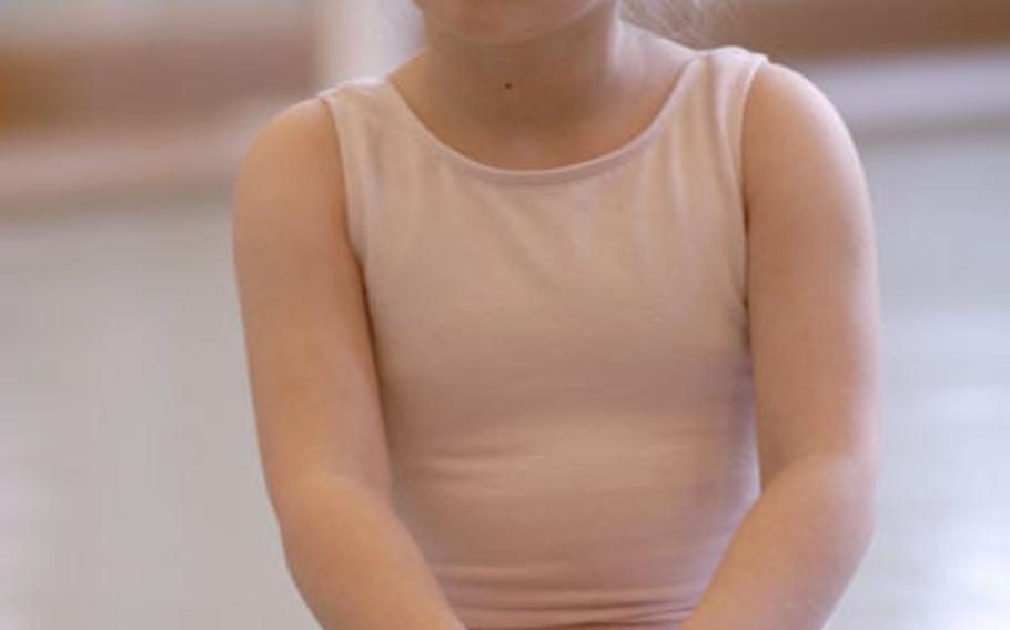 Lorelei Bearss, 4, listens to the instructor at the start of her ballet class last Wednesday at the RAF Feltwell Community Center.