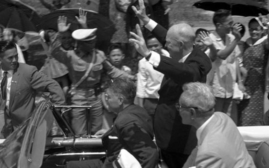 President Eisenhower rides through Manila in 1960.