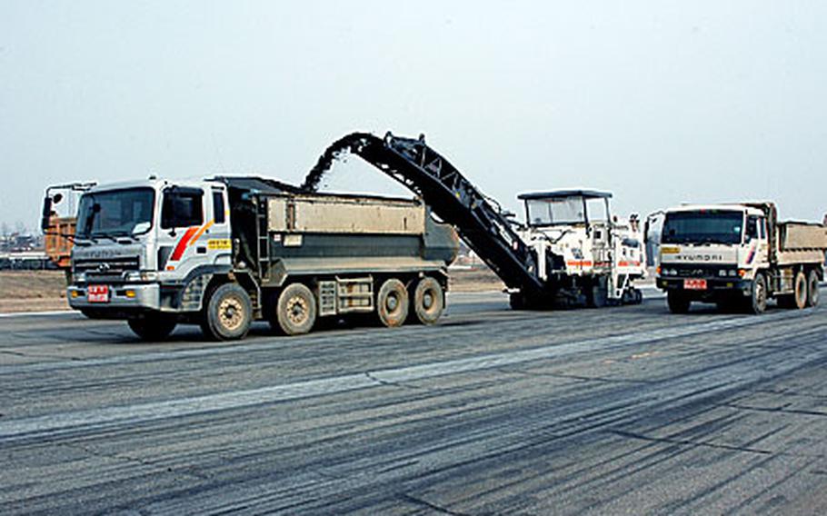At Camp Humpreys in South Korea earlier this week, workers stripping asphalt from the Desiderio Army Airfield runway as part of runway resurfacing project, set to finish in late April. The airfield is the Army's busiest outside the United States and is its premier helicopter base in South Korea.