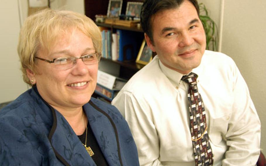 Nile C. Kinnick High School Assistant Principal Shelly Kennedy, left, and Principal David Tran may be sporting wild hair-dos in a month if freshmen at the Yokosuka Naval Base, Japan, school improve their TerraNova test scores.