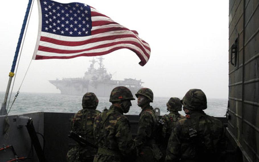 Utility Landing Craft 1631, carrying U.S. Marines and their South Korean counterparts, approaches USS Essex’ well deck through heavy seas during the Foal Eagle exercise on Thursday.