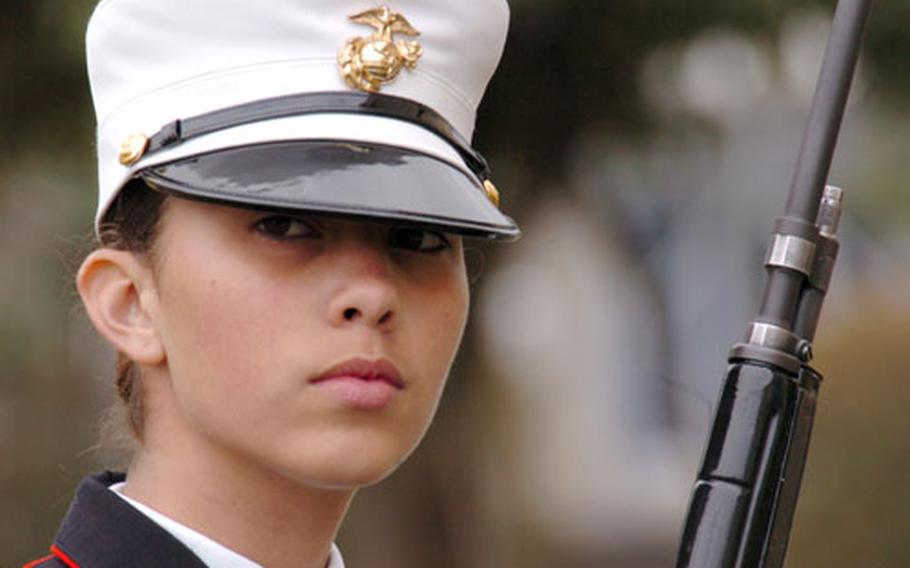 Cadet Gunnery Sgt. Jessica Doyle from Okinawa prepares for drills during the JROTC Far East Drill competition at Yokota Air Base, Japan, on Tuesday. The three-day competition brought together 165 cadets from Junior Reserve Officers Training Corps programs at high schools across the Pacific.