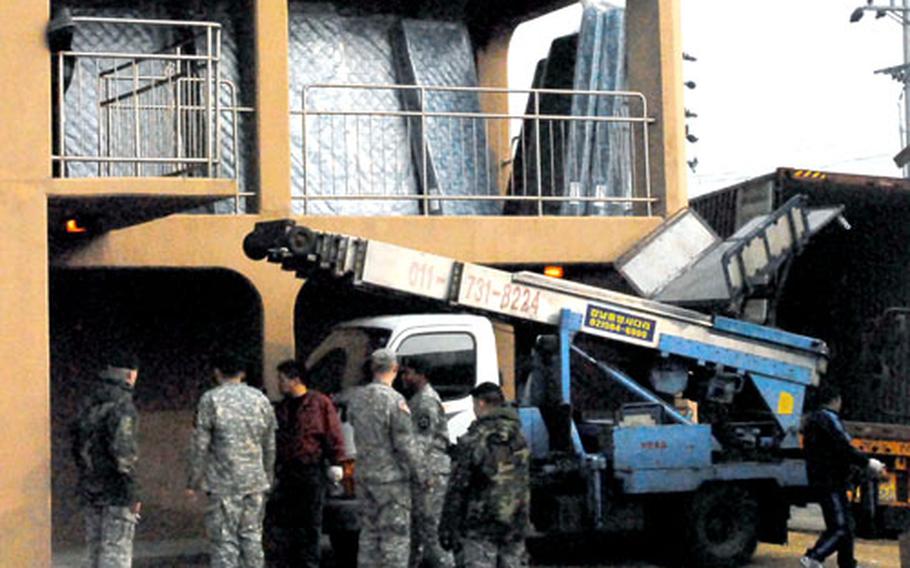 Area I public works trucks deliver new mattresses to a Camp Red Cloud barracks building in late March. Area I has replaced about 7,000 single mattresses and will begin replacing about 1,000 full-size mattresses later this month.