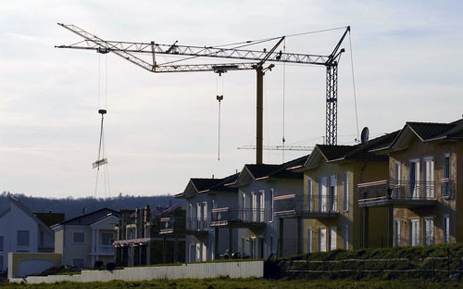 Cranes hovering over cities have become commonplace in the Kaiserslautern area such as these in the village of Machenbach near Ramstein Air Base. Ingolf Deubel, the minister of finance for Rheinland-Palatinate, stated during an interview with Stars and Stripes that there are plans to build as many as 1,800 homes to support Ramstein and Spangdahlem Air Base communities over the next few years, starting with a commitment to build 700.
