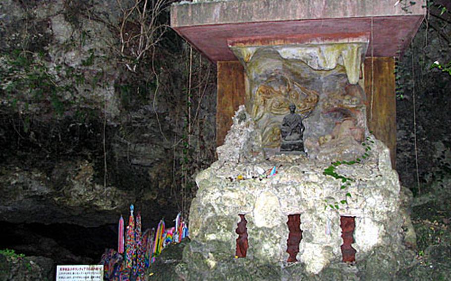 The bottom of the monument at a Yomitan "sucidie cave" called Chibichiri Gama was vandalized by right-wing nationalists and walled up to protect it from further damage. Of the 140 peoplewho hid in the cave when the Americans landed 62 years ago, 84 took their lives. (pnw# 61p cs)